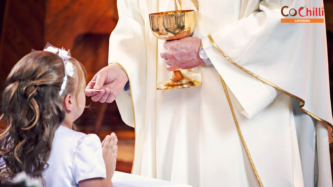 A child receives holy communion from a priest at church